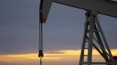 Oil Pump With Sunrise In The Background