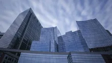 Time lapse glass skyscrapers zoom out