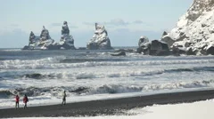 Slowmotion Waves And People At Three Pinnacles Vik