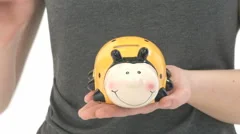Close Up Saving Money In Piggy Bank