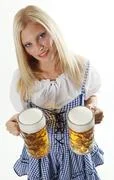 Waitress Holding Beer In A German Dirndl