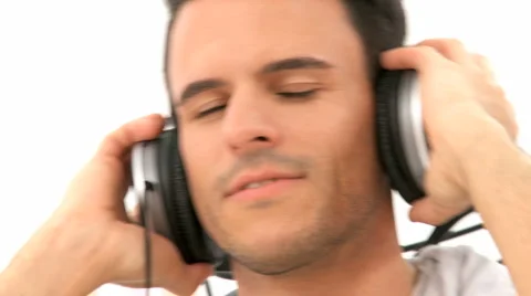 Close Up Pan Shot On Mans Face With Headphone