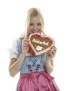 Woman Bites In A Gingerbread Heart