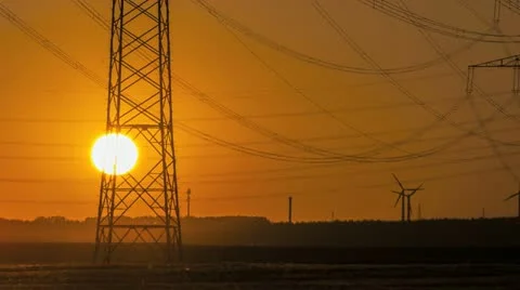 Sunset Wind Turbine And Power Lines