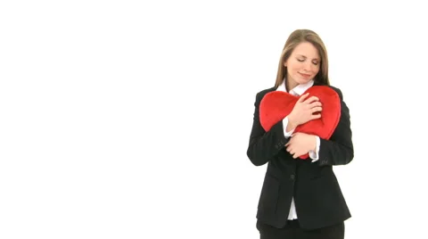 Woman Cuddling With Red Heart Pillow