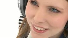 Beautiful woman listening to music with headphones