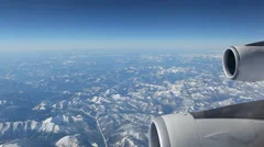 Aerial Plane View With Mountains In The Background Looking Out Of A Plane Window