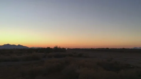 Car In The Desert At Sunrise Pan Shot