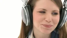 Beautiful woman listening to music with headphones