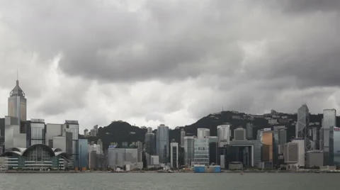 4K Time Lapse Zoom Out Hong Kong Skyline Dark Clouds