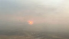 Raindrops On Airplane Window At Sunset