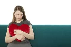 Woman With A Heart Pillow