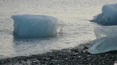 Iceberg Moving In Water At Coast
