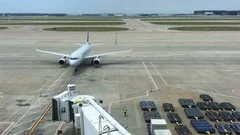 Airplane Taxiing At Gate (Editorial)