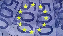 European flag with 500 Euro bills