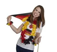Attractive Woman Shows German Flag And Smiles In Front Of White Background