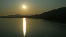 4K timelapse container ship sunset